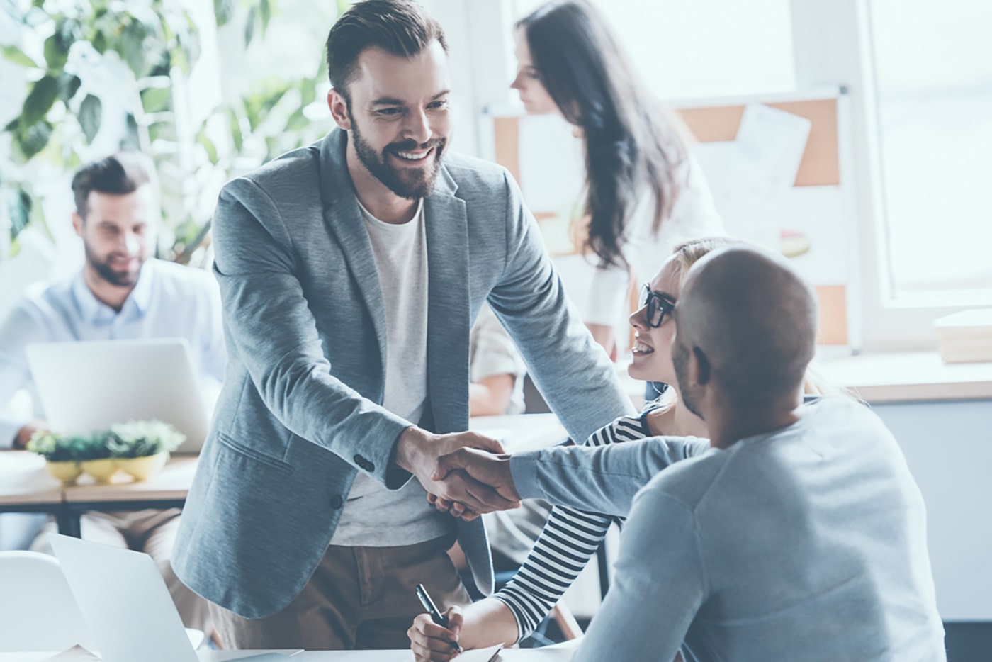 Man shaking Hands in Meeting with Another Man