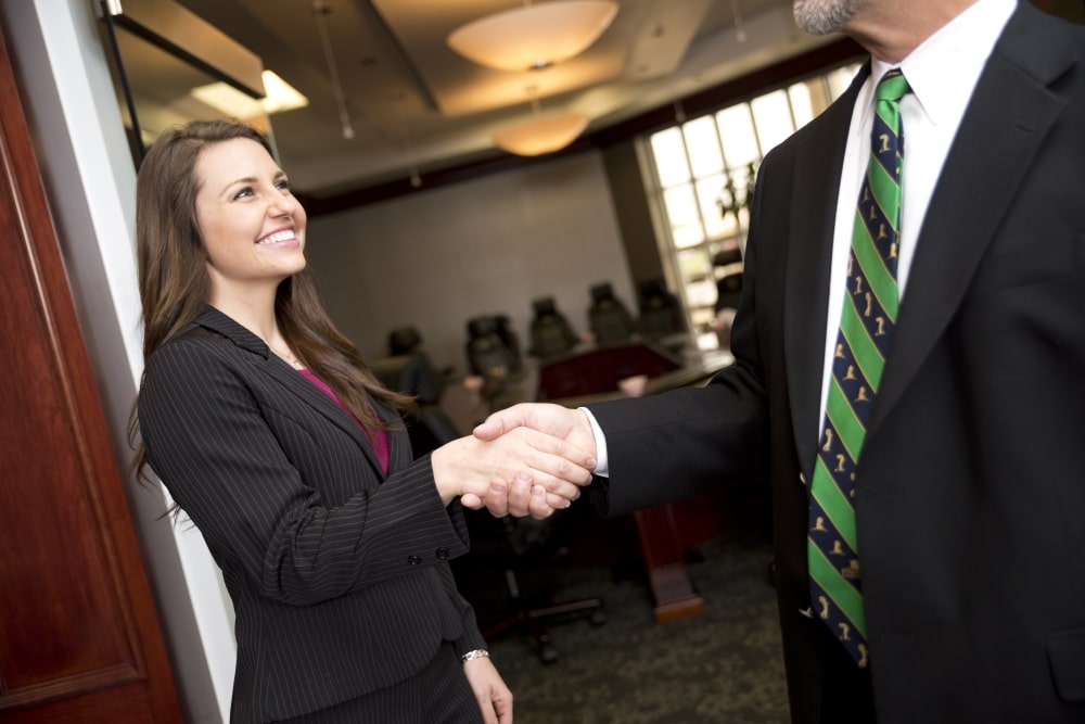 Lady shaking mans hand