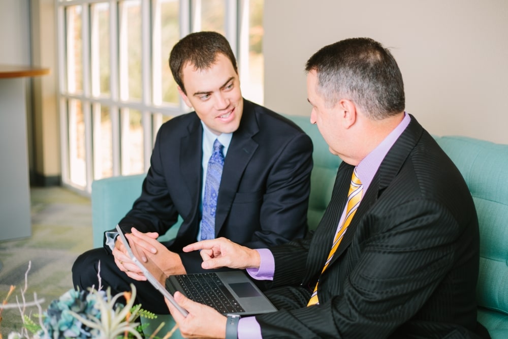 Two Men Meeting with Computer