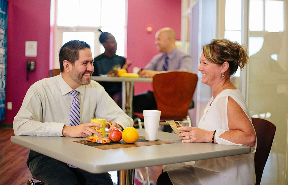 Two people meeting in break area